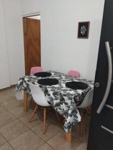 a table with chairs and a table cloth on it at Florida 68 B in Puerto Iguazú