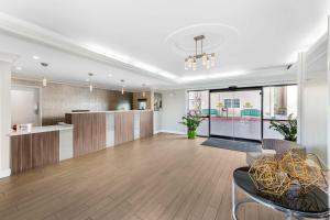 a living room with a kitchen and a dining room at Best Western Plus Ontario Airport & Convention Center in Ontario