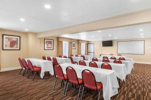 a conference room with white tables and red chairs at Best Western Plus Ontario Airport & Convention Center in Ontario +17 photos