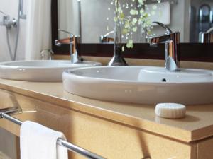 two sinks on a counter in a bathroom at The Cookbook Gastro Boutique Hotel & SPA in Calpe