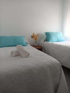 Ένα ή περισσότερα κρεβάτια σε δωμάτιο στο Duplex Avenida