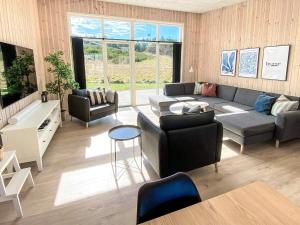 a living room with a couch and a table at 5 star holiday home in Glesborg-By Traum in Glesborg
