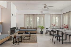 a living room with a couch and a table at Areti Guesthouse in Víssani