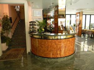 a lobby with a bar in the middle of a store at Hotel Cavalluccio Marino in Gabicce Mare