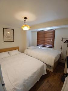 Ένα ή περισσότερα κρεβάτια σε δωμάτιο στο Yongsan Hyochang Park 3 minutes, breakfast included, luggage storage service