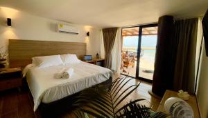 Marazao Beach Hotel & Spa客房内的一张或多张床位