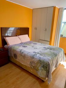 a bedroom with a bed and a window and a bed sidx sidx sidx at Omi's Room 2 in Lima