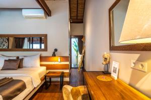 Una cama o camas en una habitación de Coco Lodge