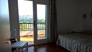 Apartamentos Encanto Del Mar客房内的一张或多张床位