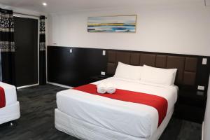 Postel nebo postele na pokoji v ubytování Krishna Motel - Newly Built in Papakura