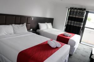 Postel nebo postele na pokoji v ubytování Krishna Motel - Newly Built in Papakura