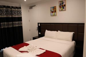 Postel nebo postele na pokoji v ubytování Krishna Motel - Newly Built in Papakura