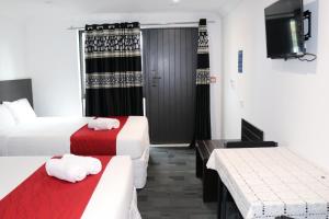 Postel nebo postele na pokoji v ubytování Krishna Motel - Newly Built in Papakura