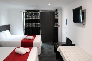 Postel nebo postele na pokoji v ubytování Krishna Motel - Newly Built in Papakura