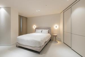 Postel nebo postele na pokoji v ubytování Hotel Modak Namdaemun