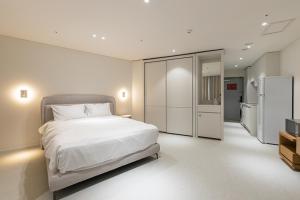 Postel nebo postele na pokoji v ubytování Hotel Modak Namdaemun