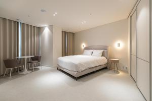 Postel nebo postele na pokoji v ubytování Hotel Modak Namdaemun