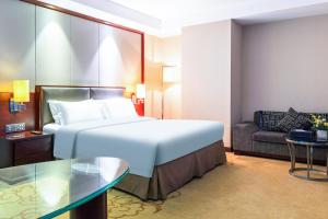 Voodi või voodid majutusasutuse Shenzhen Avant-Garde Hotel toas