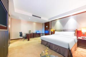 Voodi või voodid majutusasutuse Shenzhen Avant-Garde Hotel toas
