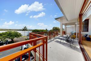 a balcony with a view of the water at Penthouse at Colonial in Noosaville