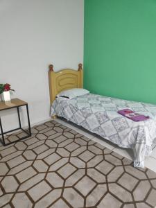 Postel nebo postele na pokoji v ubytování Hostel Caetano