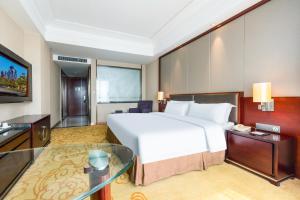 Voodi või voodid majutusasutuse Shenzhen Avant-Garde Hotel toas
