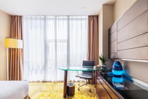 Voodi või voodid majutusasutuse Shenzhen Avant-Garde Hotel toas
