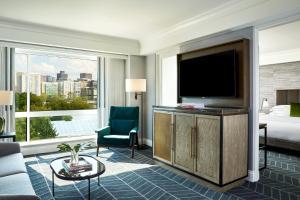 a hotel room with a television and a bed at Kimpton Marlowe by IHG in Cambridge