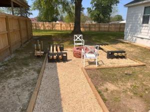a playground with benches and a chair in a yard at Family Retreat Prime Location in Decatur in Decatur