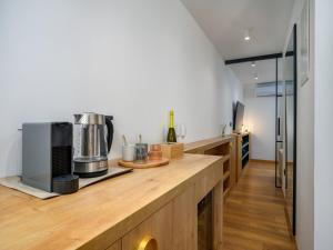 a kitchen with a counter with a coffee maker at Room in Porec Old Town by Waterfront in Poreč +6 photos