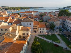 an aerial view of a city with buildings at Room in Porec by Old Town & Waterfront in Poreč