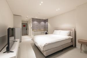 Postel nebo postele na pokoji v ubytování Hotel Modak Namdaemun