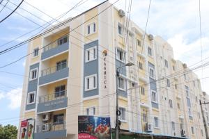 a large white building with a lot of windows at Hotel Starlight Chennai near DLF,L&T,Miot,Tradecenter,Ramachandra medical coll in Chennai
