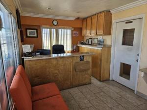 a kitchen with an island and a counter in a room at Aerospace Inn in Mojave