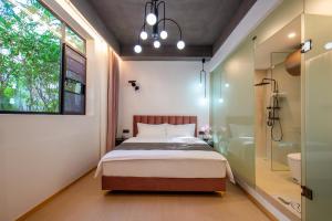 Katil atau katil-katil dalam bilik di Homie Inn
