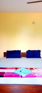 Llit o llits en una habitació de Unicorn guest house