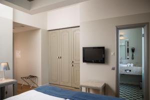 Postel nebo postele na pokoji v ubytování Opera Hotel