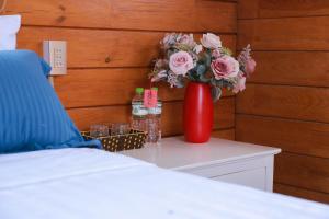 Postel nebo postele na pokoji v ubytování Healing Space Bungallow Bao Loc