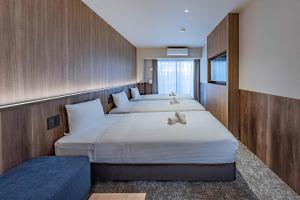 Postel nebo postele na pokoji v ubytování Apartment Hotel 11 Kuromon 5