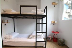Postel nebo postele na pokoji v ubytování Taipei Sunny Hostel