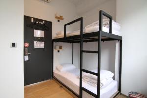 Postel nebo postele na pokoji v ubytování Taipei Sunny Hostel