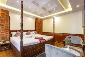 Rúm í herbergi á Amarawati Boutique Hotel