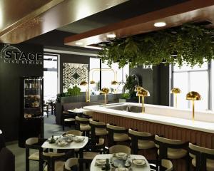 a restaurant with tables and chairs and a bar at Central Suites in Bucharest