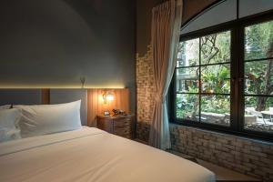 Postel nebo postele na pokoji v ubytování Bangkok Oasis Hotel + 94 fotografií