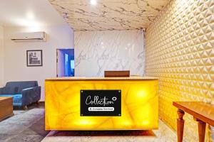 a yellow counter with a sign on it in a room at FabHotel Golden Vista in Bengaluru