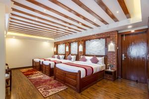 Rúm í herbergi á Amarawati Boutique Hotel