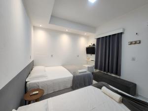 Eco House Gaivota - Cond Ville Portal das Dunas客房内的一张或多张床位