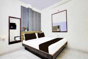Postel nebo postele na pokoji v ubytování Super Hotel O Paharganj Chuna Mandi near Railway Station + 22 fotografií