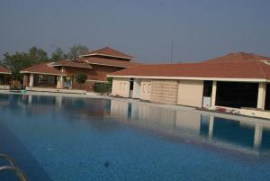 a large swimming pool in front of a house at Lumbini Hotel Kasai in Rummindei