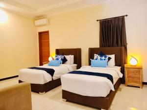 Ένα ή περισσότερα κρεβάτια σε δωμάτιο στο Shine villa sanur 2 +8 φωτογραφίες
